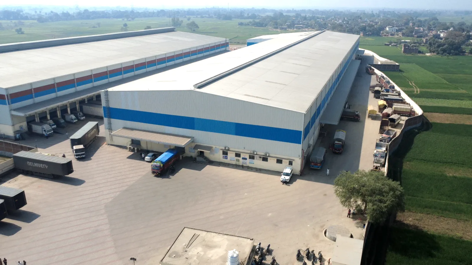 Wide concrete truck apron at NH-30 warehouse campus, Patna