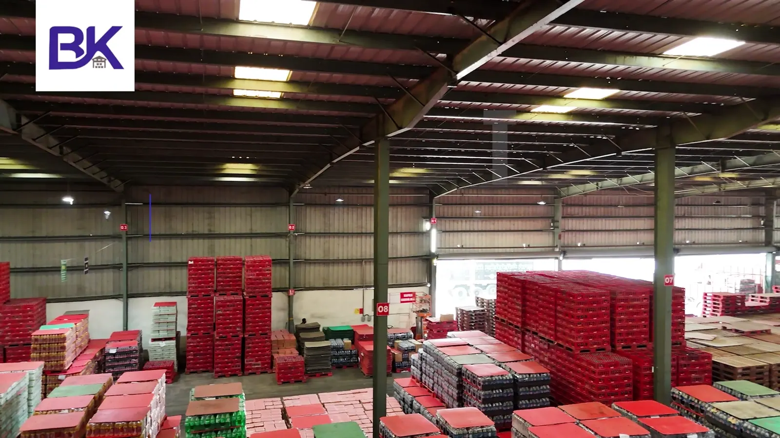 Beverage crates racked inside the Fatuha campus warehouse