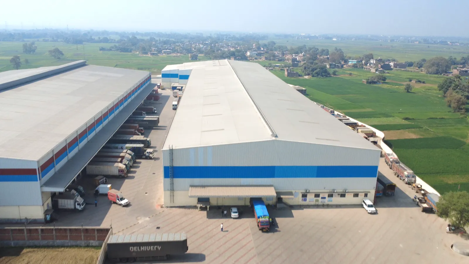 Dock bays with logistics trucks at the Fatuha campus, Patna